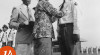 Foto istri Menteri Perhubungan Ny. Suchjar Tedjasukmana didampingi Direktur Akademi Penerbangan Indonesia (API) sedang menyematkan Brevet (wing) kepada salah seorang penerbang lulusan API. 14 Juni 1956.